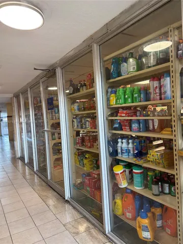 a view of a tall building with a yard