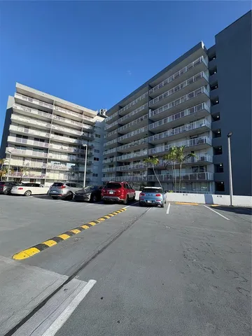 a view of a tree in front of a yard