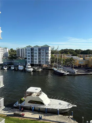 a view of a lake with tall buildings