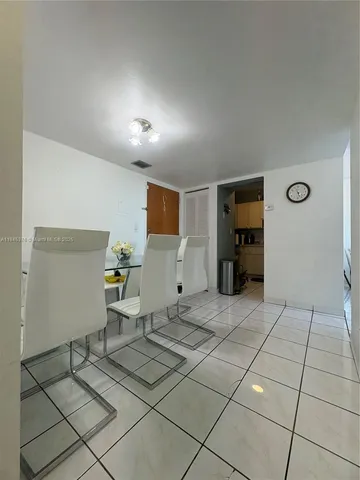 a view of a livingroom with furniture and a window