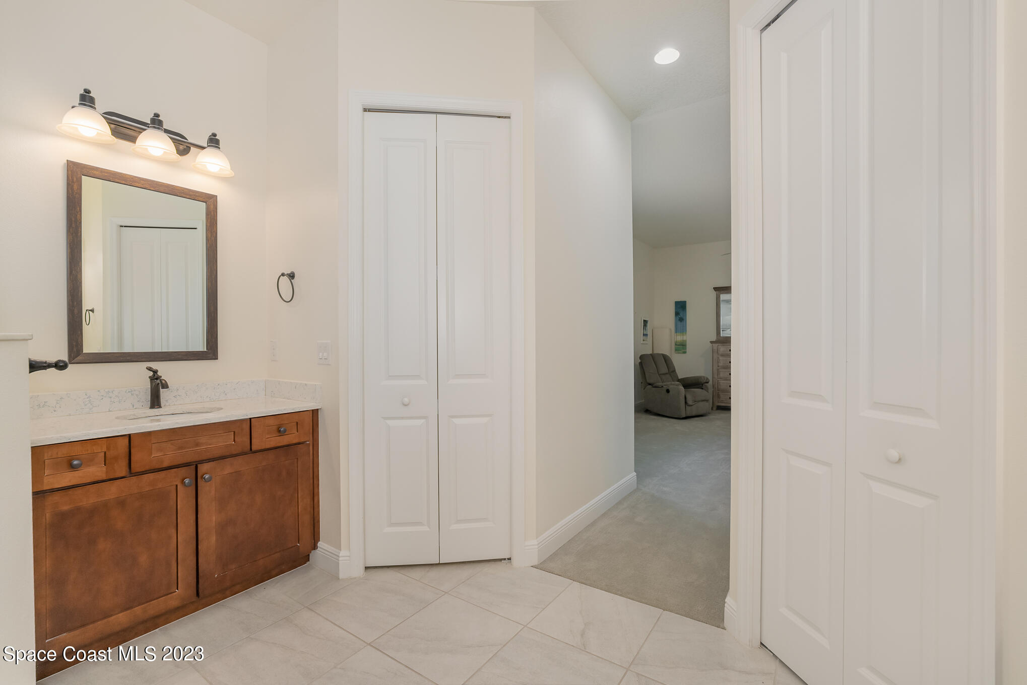 448 Lorelei Avenue Melbourne, FL 32901 - Photo 14 of 31 a bathroom with a sink and a mirror