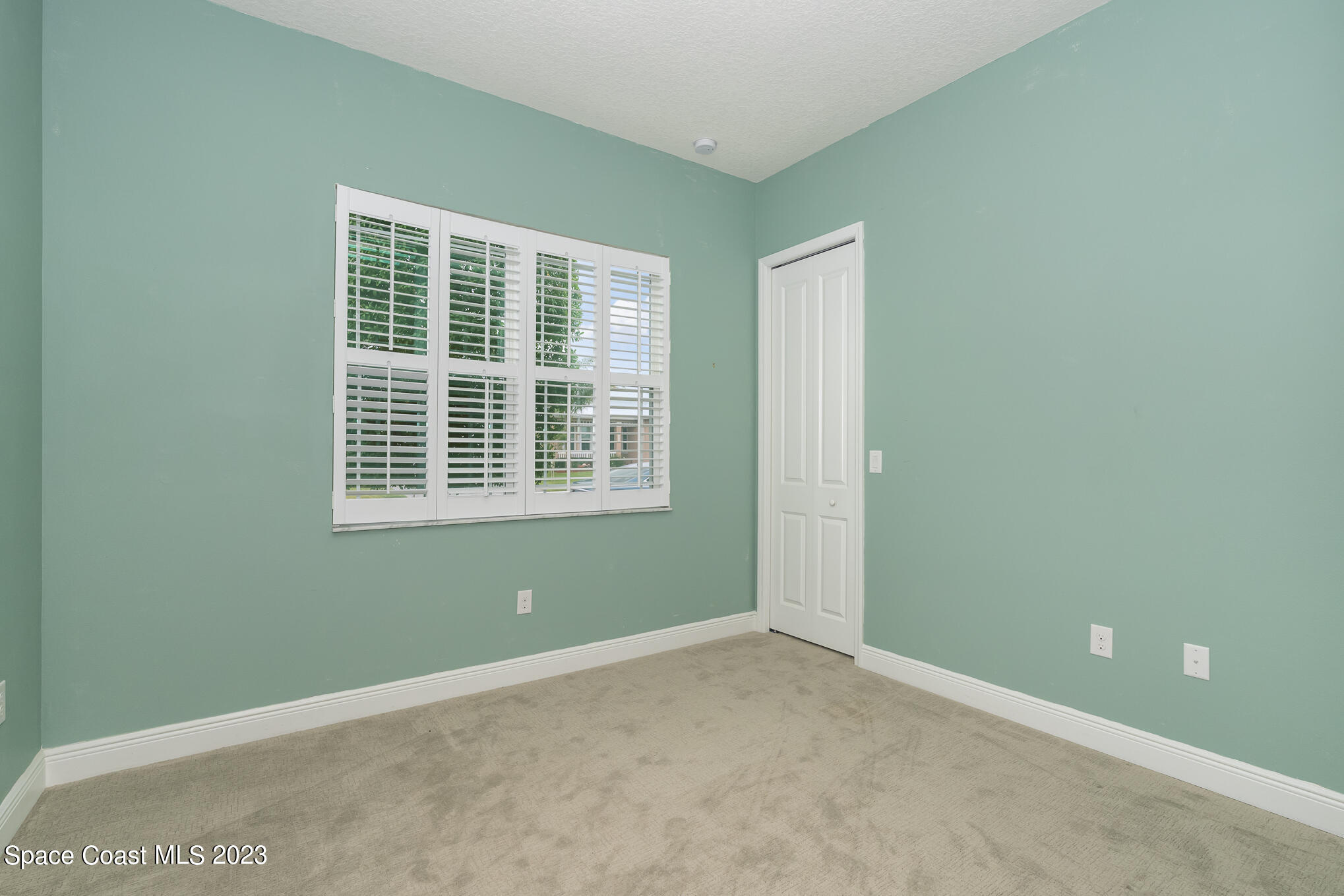 448 Lorelei Avenue Melbourne, FL 32901 - Photo 18 of 31 a view of an empty room with a window