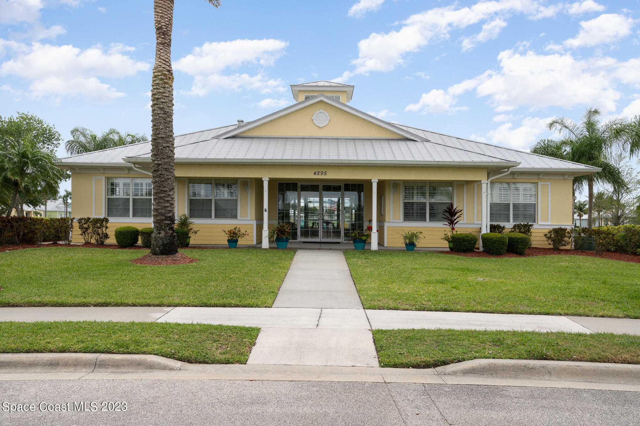 448 Lorelei Avenue Melbourne, FL 32901 - Photo 24 of 31 a front view of a house with a yard and garage