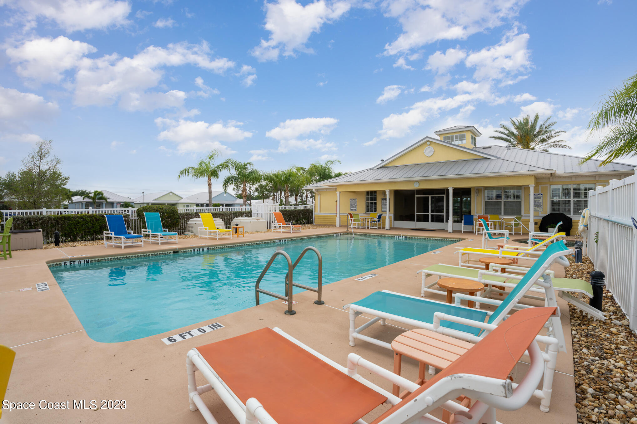 448 Lorelei Avenue Melbourne, FL 32901 - Photo 30 of 31 a view of a house with pool and chairs