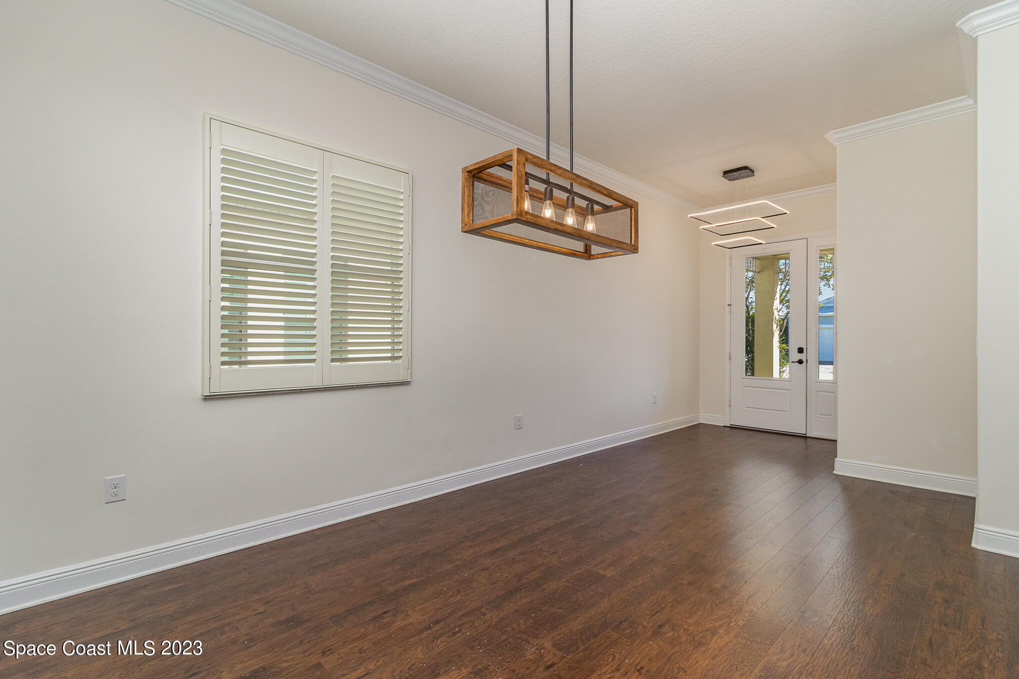 448 Lorelei Avenue Melbourne, FL 32901 - Photo 5 of 31 a view of an entryway with wooden floor
