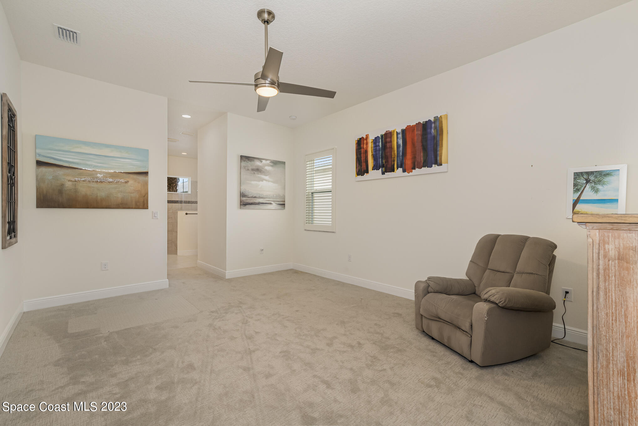 448 Lorelei Avenue Melbourne, FL 32901 - Photo 9 of 31 a living room with furniture and a flat screen tv