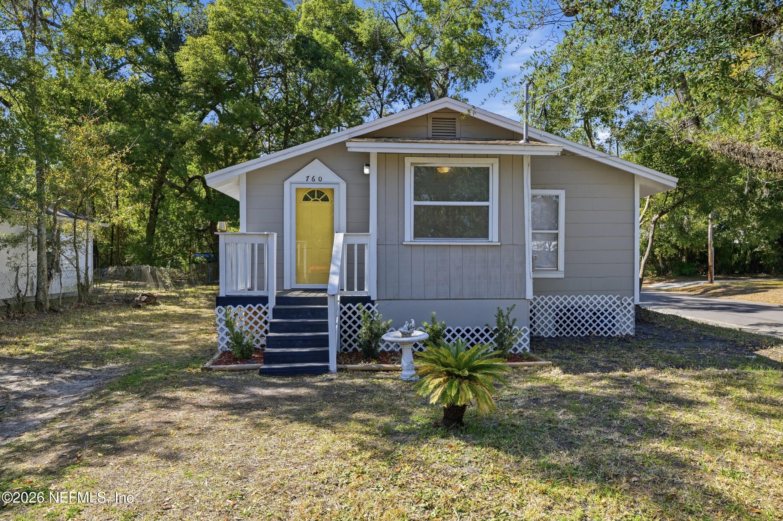 760 Westbrook Road Jacksonville, FL 32209 - Photo 1 of 11 a front view of a house with a yard