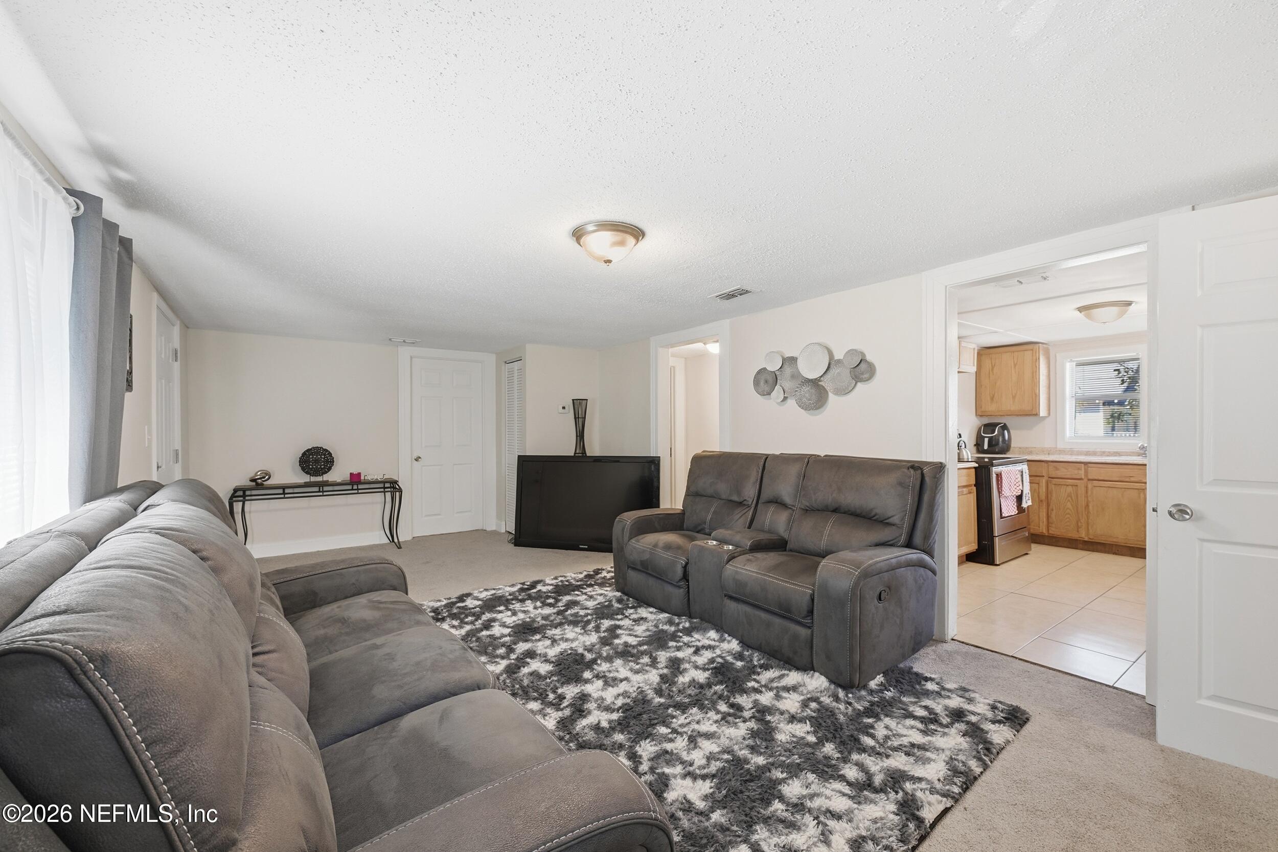 760 Westbrook Road Jacksonville, FL 32209 - Photo 2 of 11 a living room with furniture and a couch