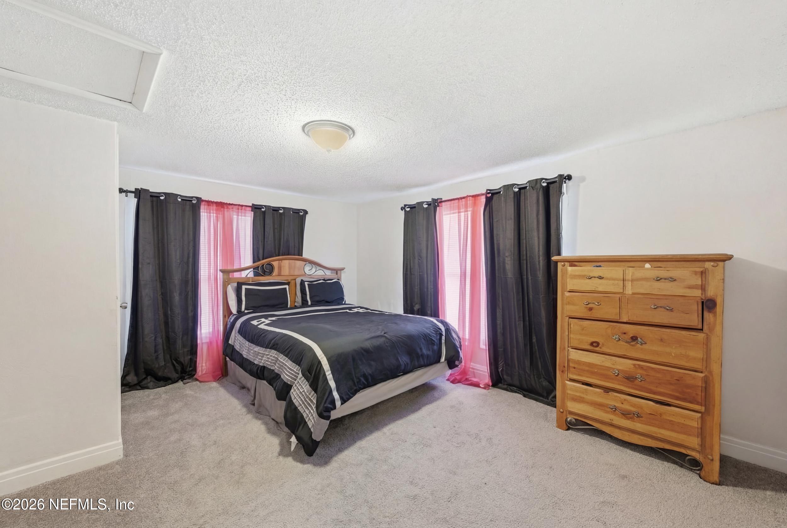 760 Westbrook Road Jacksonville, FL 32209 - Photo 6 of 11 a bedroom with a bed and a closet