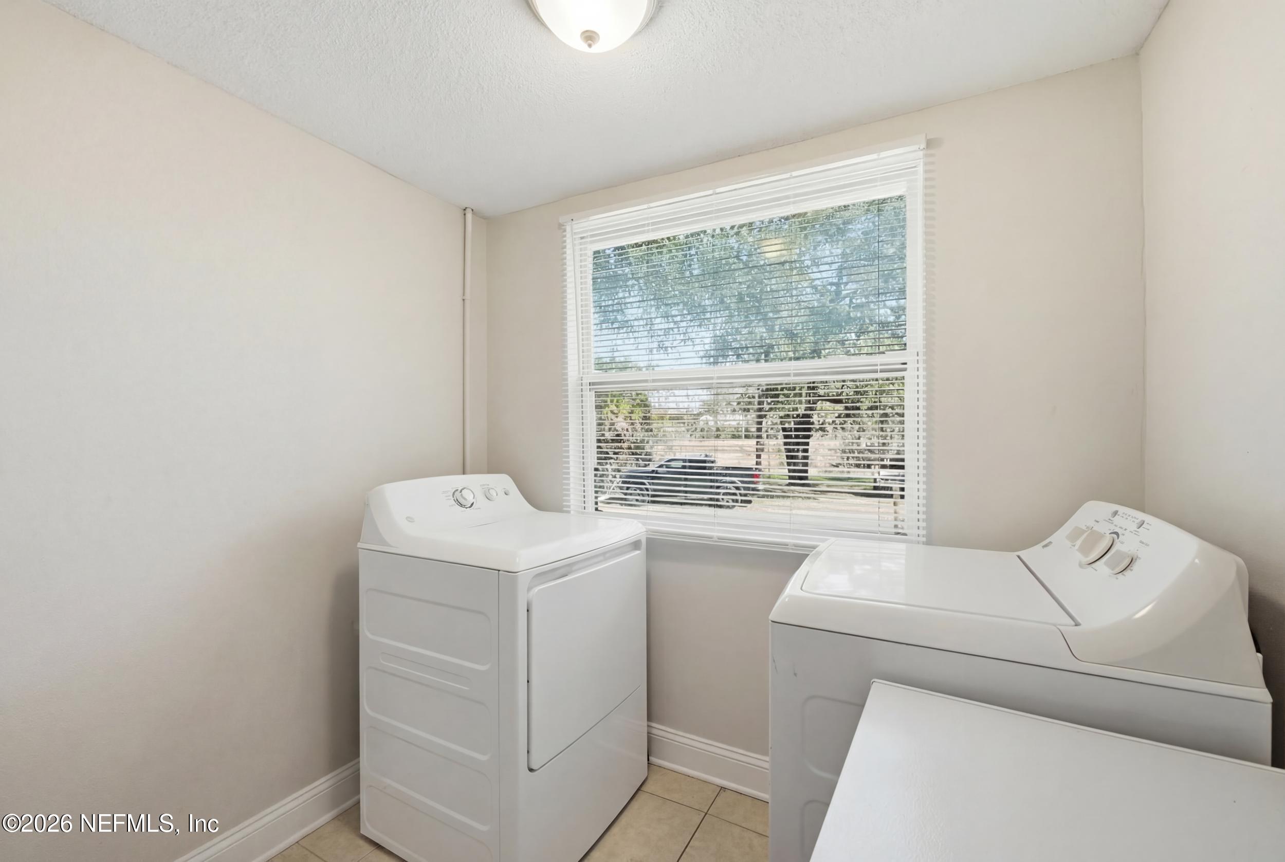 760 Westbrook Road Jacksonville, FL 32209 - Photo 9 of 11 a utility room with dryer and washer