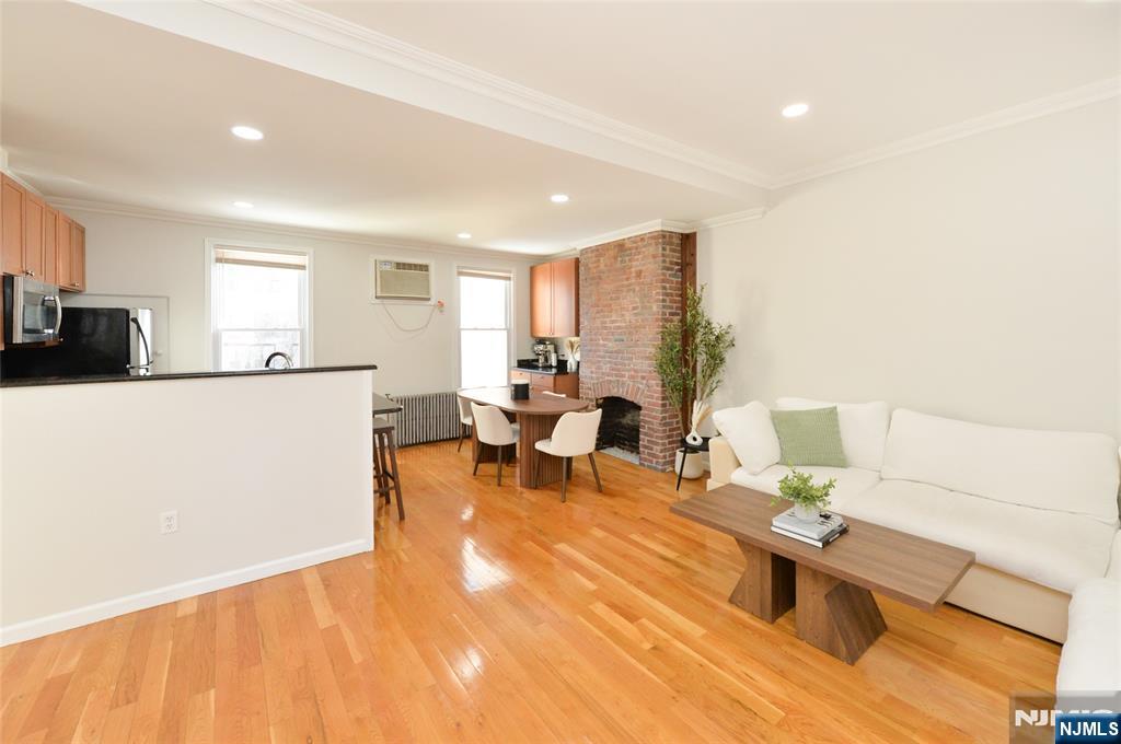 209 Adams Street, Unit 5 Hoboken, NJ 07030 - Photo 14 of 15 a living room with furniture and a table