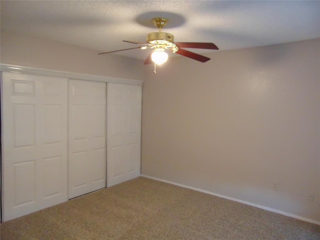 9611 Walnut Street, Unit 1303 Dallas, TX 75081 - Photo 5 of 16 a view of empty room with window