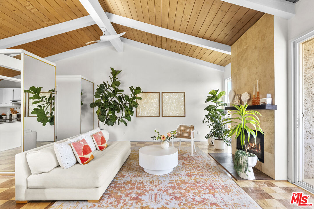 28366 Rey De Copas Lane Malibu, CA 90265 - Photo 1 of 20 a living room with furniture and a potted plant