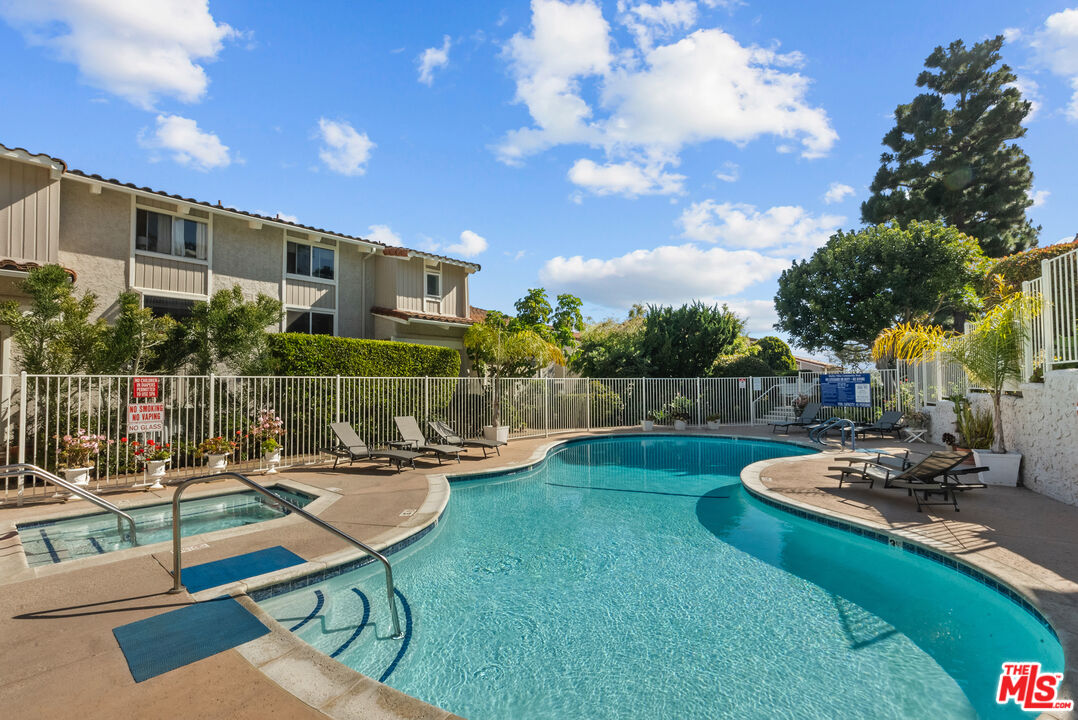 28366 Rey De Copas Lane Malibu, CA 90265 - Photo 15 of 20 a view of a house with backyard sitting area and swimming pool