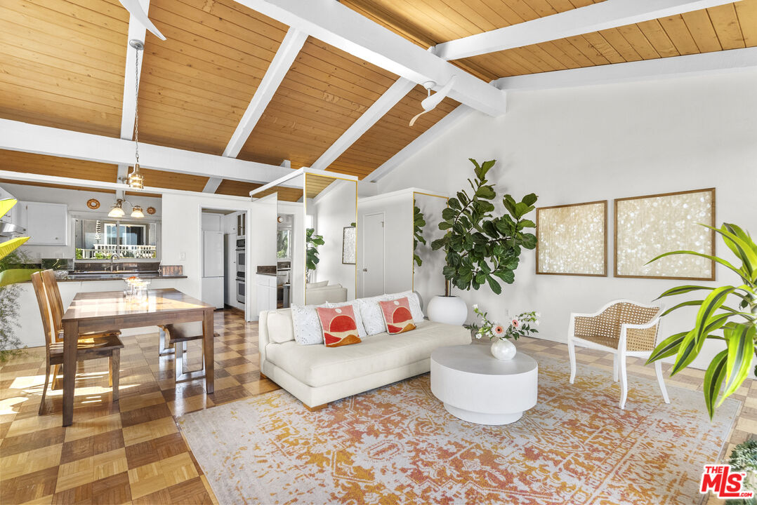 28366 Rey De Copas Lane Malibu, CA 90265 - Photo 3 of 20 a living room with furniture and a potted plant