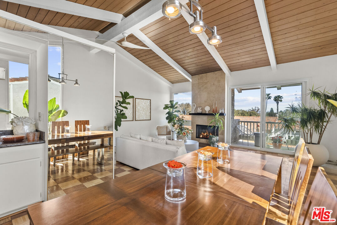 28366 Rey De Copas Lane Malibu, CA 90265 - Photo 4 of 20 a living room with furniture a wooden floor and next to a large window