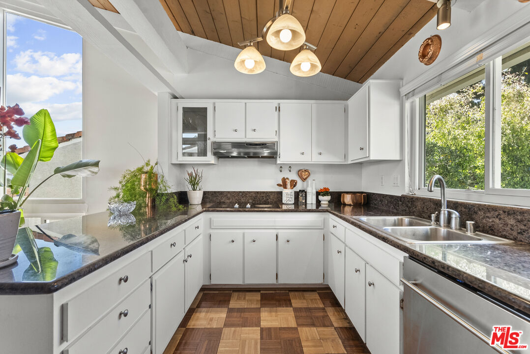 28366 Rey De Copas Lane Malibu, CA 90265 - Photo 8 of 20 a kitchen with a sink cabinets and window