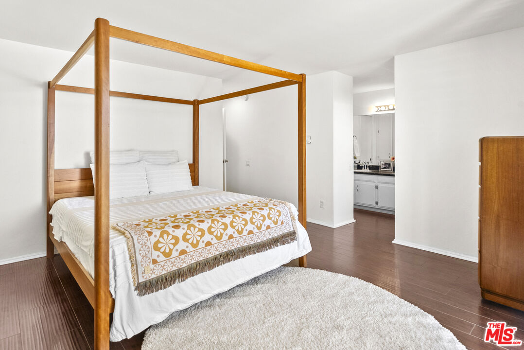 28366 Rey De Copas Lane Malibu, CA 90265 - Photo 9 of 20 a bedroom with a bed and a large window