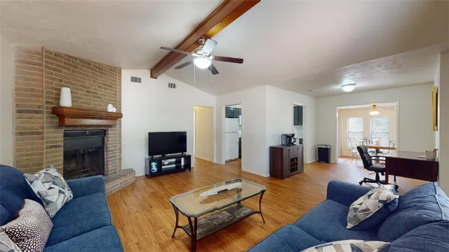 a living room with furniture and a fireplace