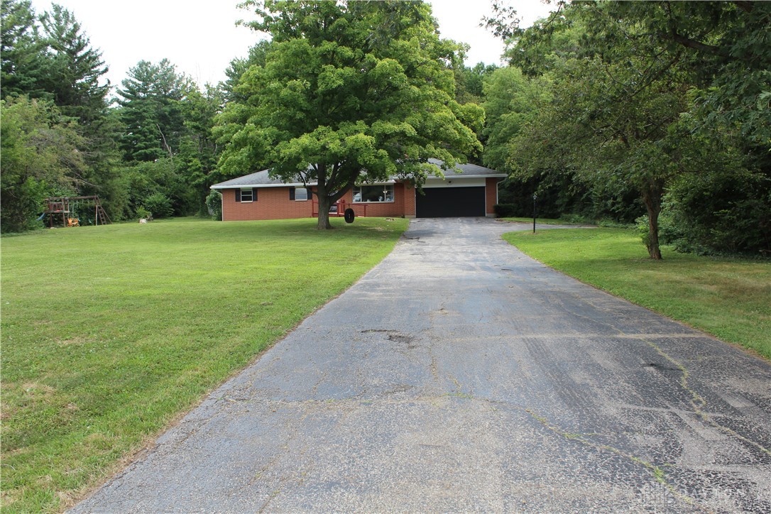 8390 Dog Leg Road Dayton, OH 45414 - Photo 2 of 61 Long driveway nestled back on a private 1.75 Ac lot