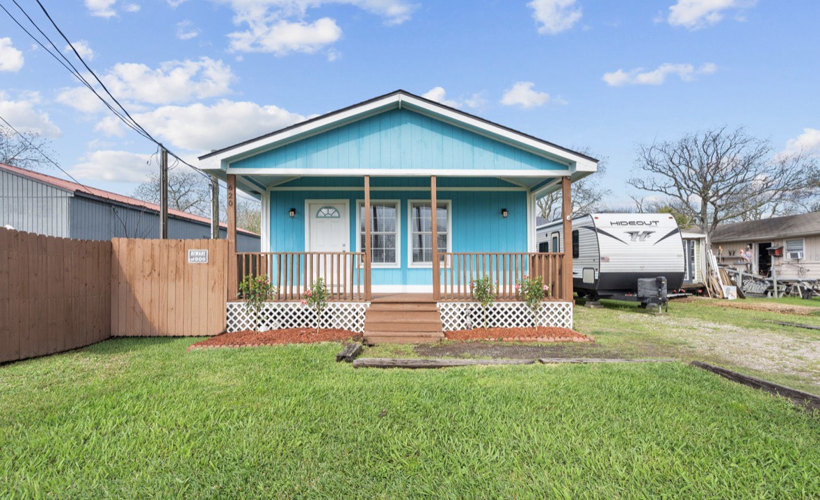 620 6th Street Dickinson, TX 77539 - Photo 1 of 36 a front view of a house with a garden and plants