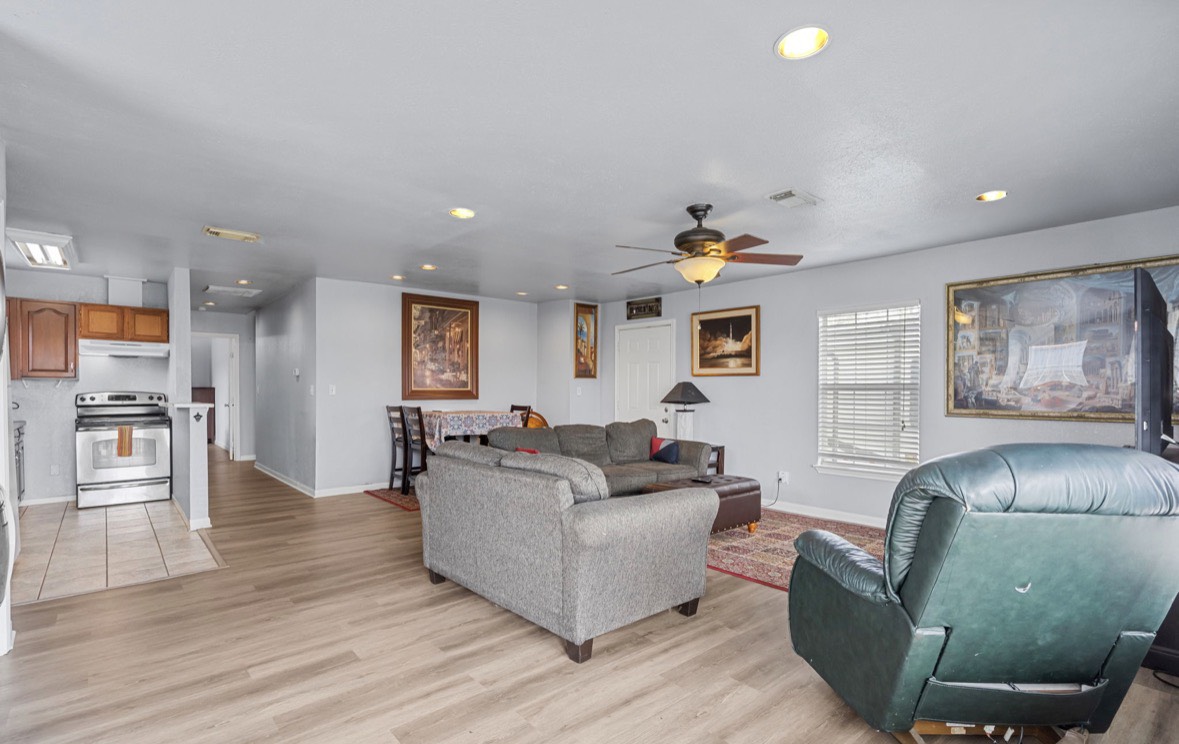 620 6th Street Dickinson, TX 77539 - Photo 11 of 36 a living room with furniture and a wooden floor