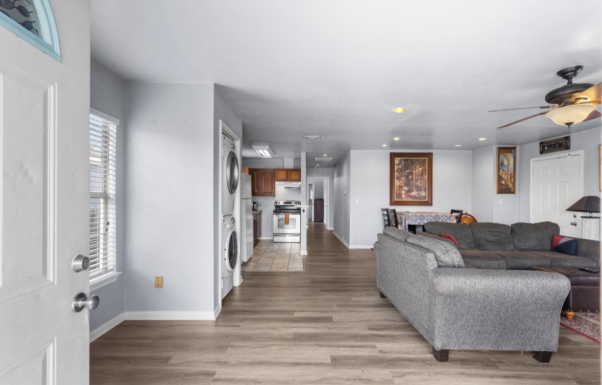 620 6th Street Dickinson, TX 77539 - Photo 9 of 36 a living room with furniture and a wooden floor