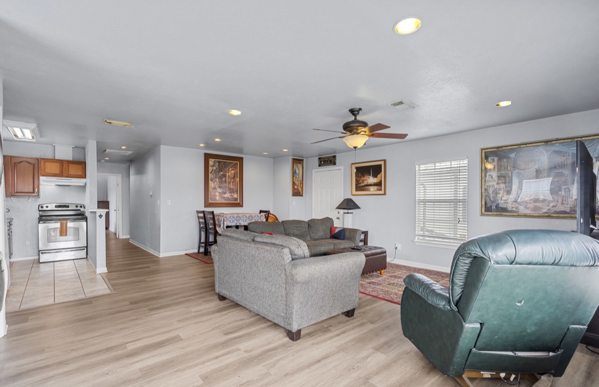 620 6th Street Dickinson, TX 77539 - Photo 10 of 36 a living room with furniture and a wooden floor