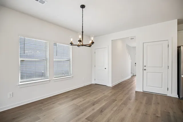a kitchen with stainless steel appliances a refrigerator sink and microwave