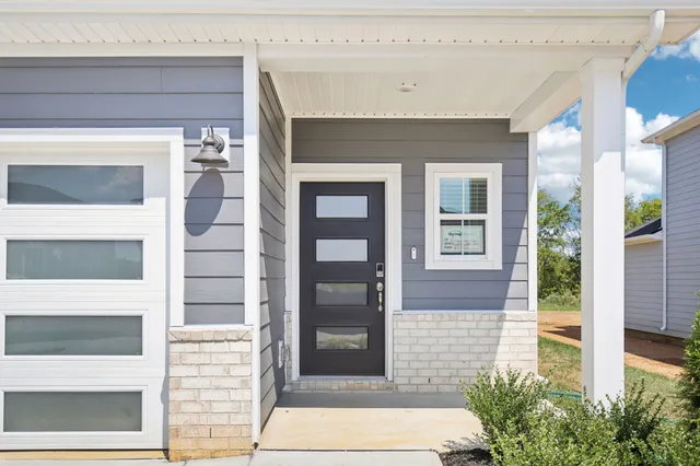 a front view of a house with a glass door