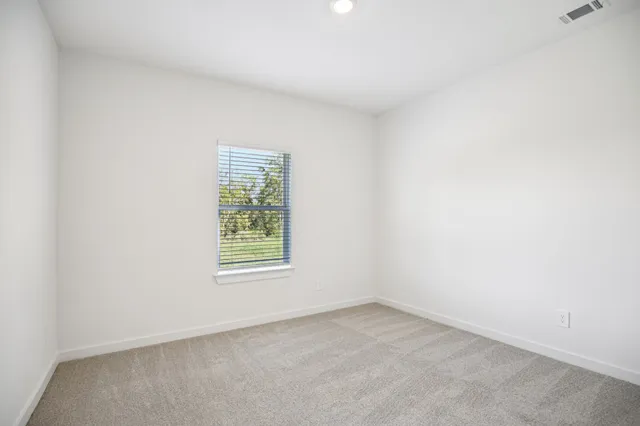 a bathroom with a double vanity sink and mirror