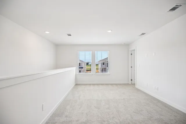a bathroom with double vanity sinks and a mirror