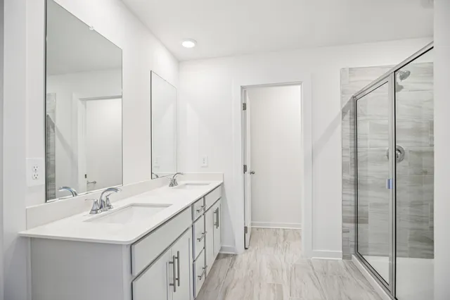 a white bath tub sitting next to a white sink