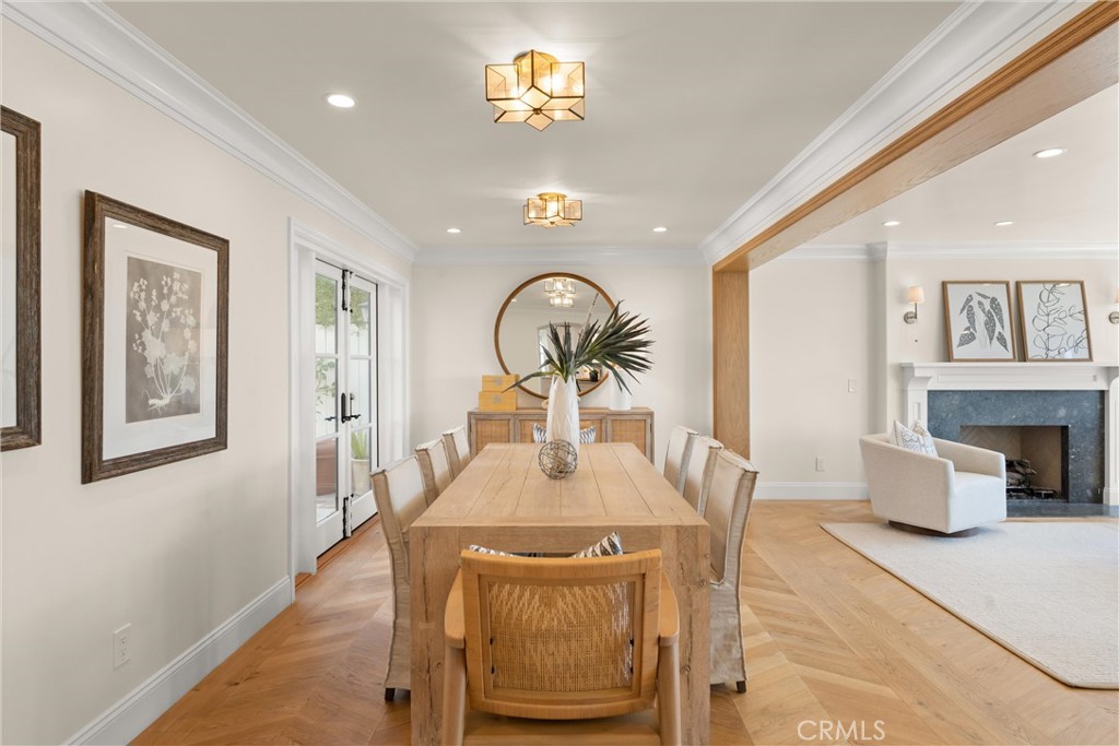 503 Hazel Drive Corona del Mar, CA 92625 - Photo 13 of 39 a view of a dining room with furniture a chandelier and wooden floor