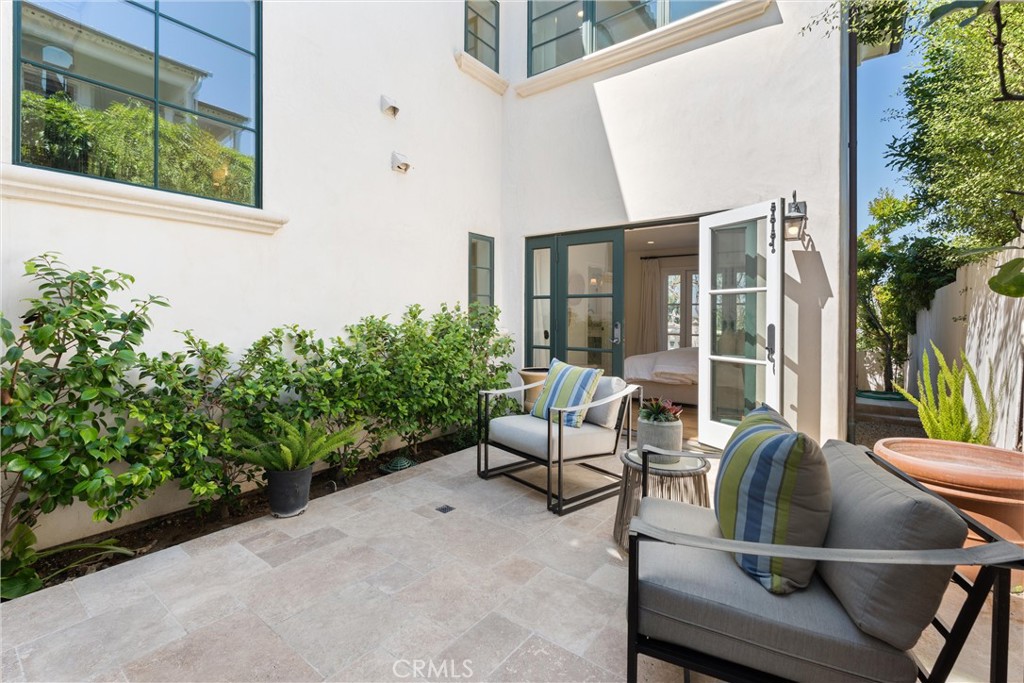 503 Hazel Drive Corona del Mar, CA 92625 - Photo 14 of 39 a view of a patio with couches chairs and potted plants