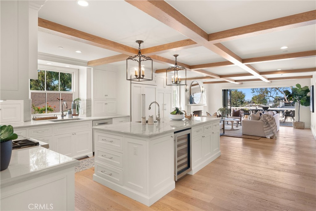 503 Hazel Drive Corona del Mar, CA 92625 - Photo 15 of 39 a large white kitchen with lots of counter space a sink and appliances