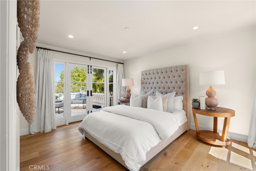503 Hazel Drive Corona del Mar, CA 92625 - Photo 20 of 39 a large bedroom with a bed and large window