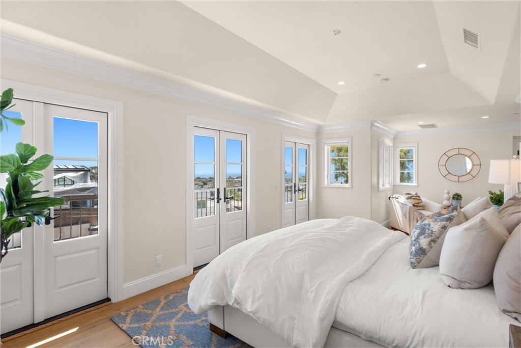 503 Hazel Drive Corona del Mar, CA 92625 - Photo 23 of 39 a bedroom with a large bed and a closet