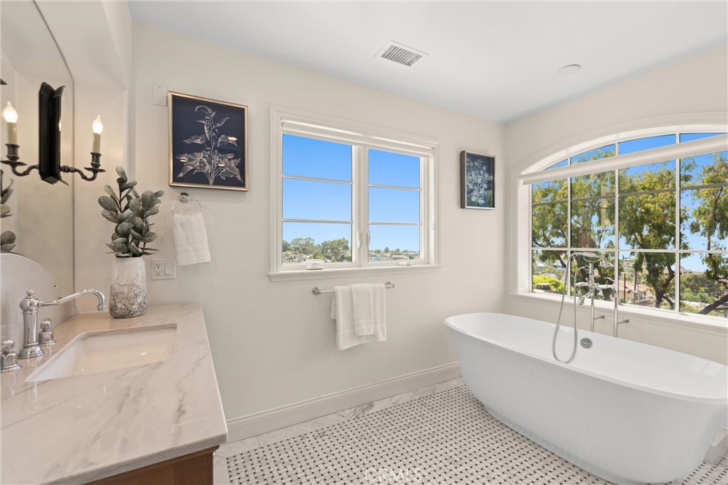 503 Hazel Drive Corona del Mar, CA 92625 - Photo 24 of 39 a bathroom with a granite countertop sink and a bathtub