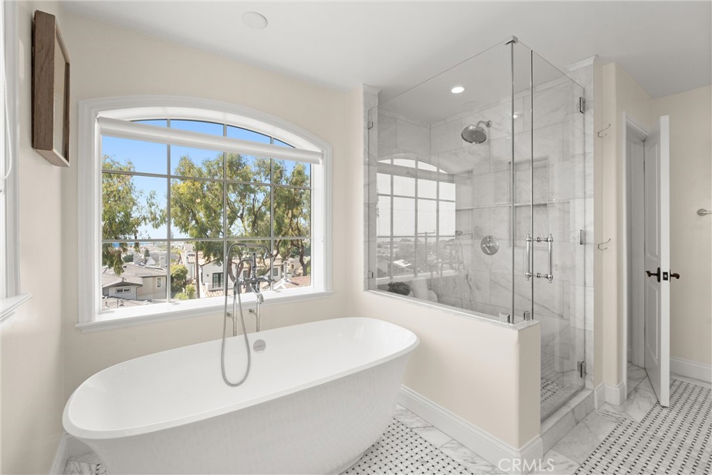 503 Hazel Drive Corona del Mar, CA 92625 - Photo 26 of 39 a bathroom with a tub a sink and glass door