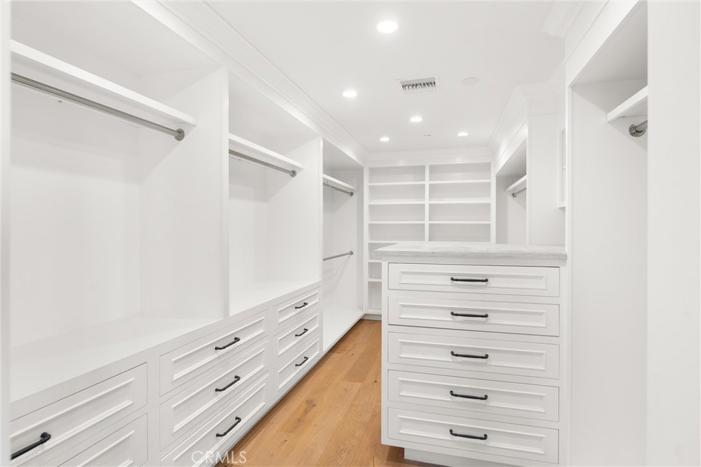 503 Hazel Drive Corona del Mar, CA 92625 - Photo 30 of 39 a view of walk in closet with empty racks