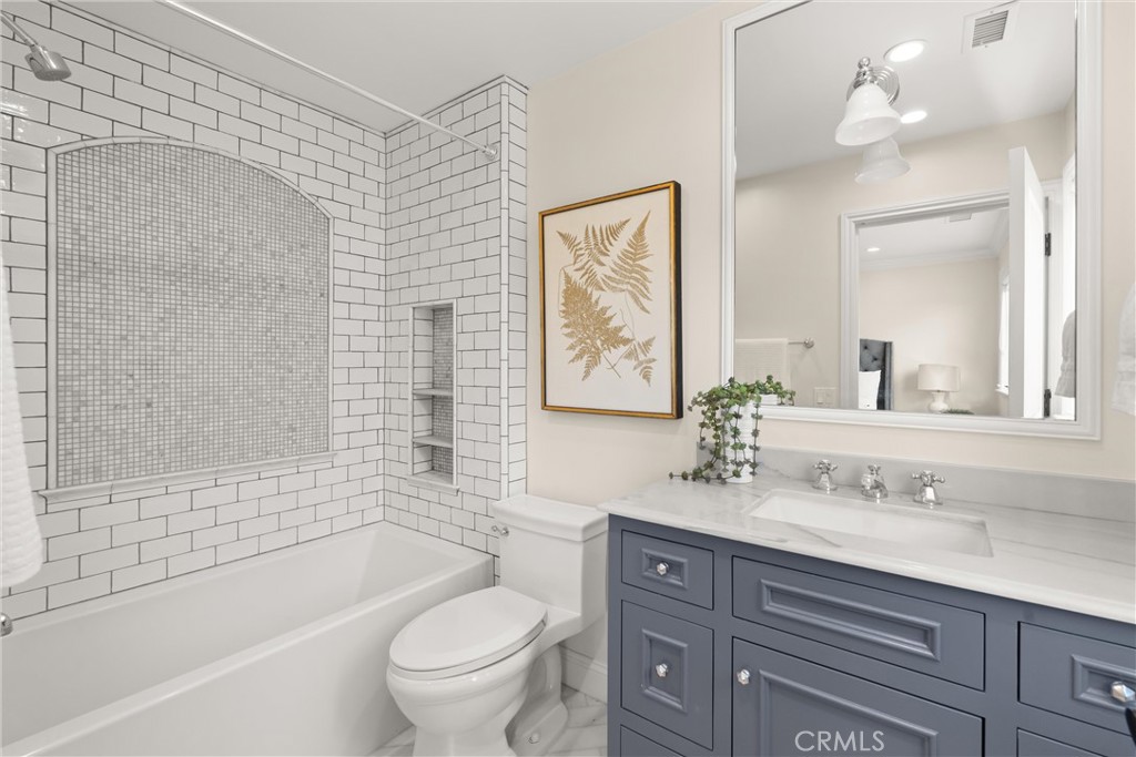 503 Hazel Drive Corona del Mar, CA 92625 - Photo 31 of 39 a bathroom with a bathtub shower sink vanity mirror and toilet
