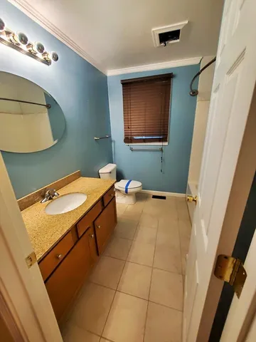 a bathroom with a toilet and a sink