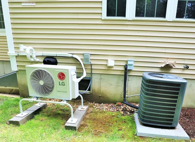 a view of a house with a yard and sitting area
