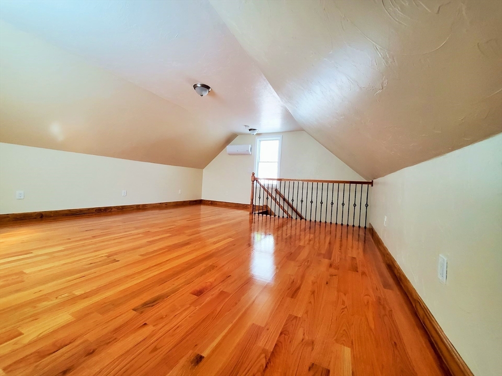 90 Central Street, Unit 2 East Bridgewater, MA 02333 - Photo 8 of 16 a view of an empty room with wooden floor