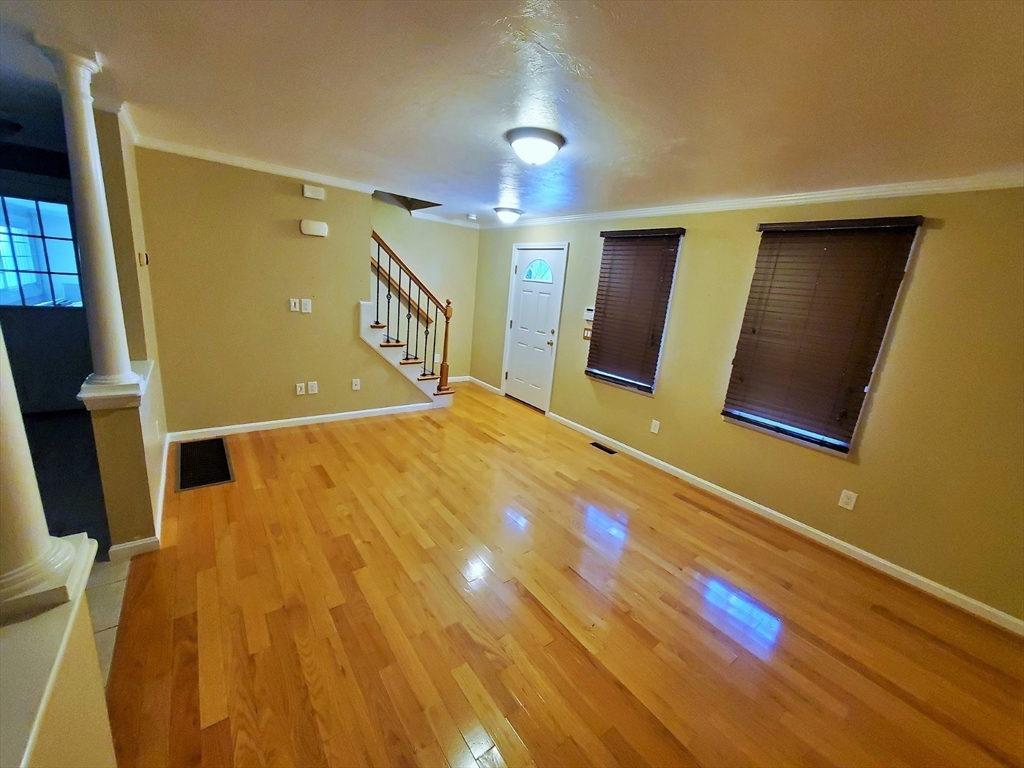 90 Central Street, Unit 2 East Bridgewater, MA 02333 - Photo 9 of 16 a bedroom with a bed and a flat screen tv