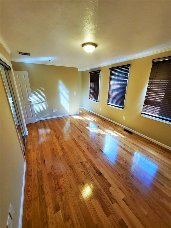 90 Central Street, Unit 2 East Bridgewater, MA 02333 - Photo 10 of 16 a view of empty room with wooden floor