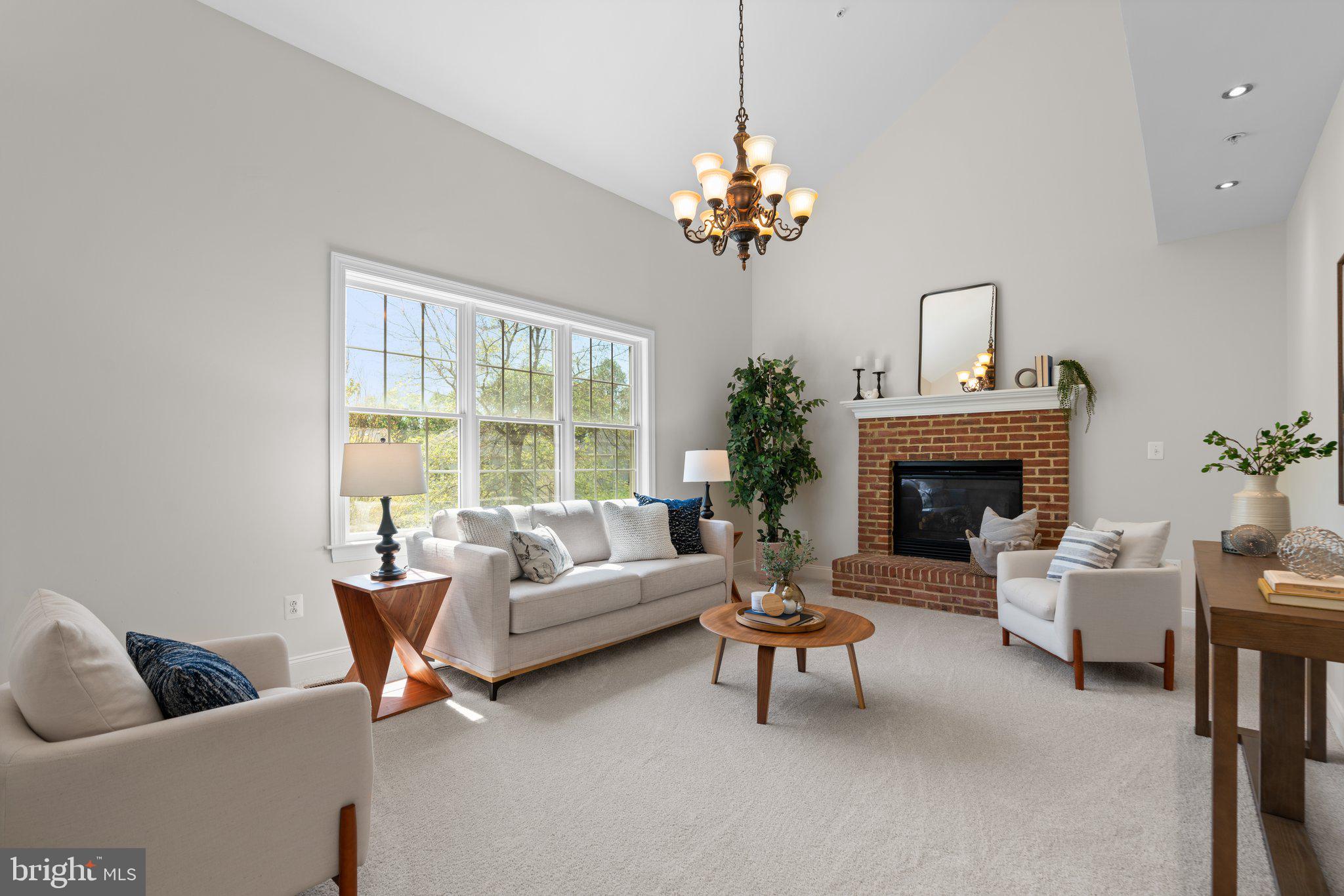 22104 Ginger Tree Way Clarksburg, MD 20871 - Photo 19 of 57 a living room with furniture and a fireplace