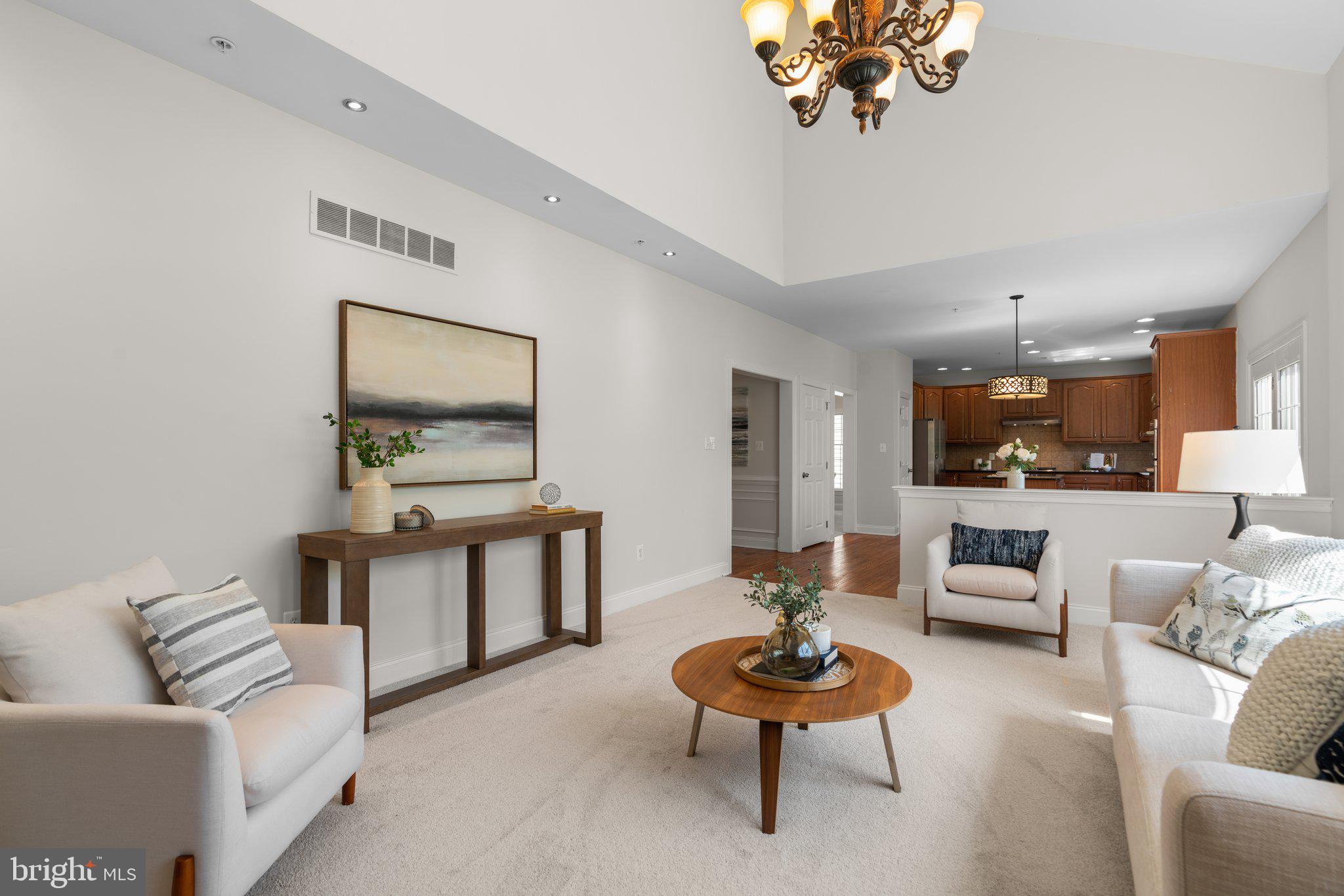 22104 Ginger Tree Way Clarksburg, MD 20871 - Photo 23 of 57 a living room with furniture and a wooden floor