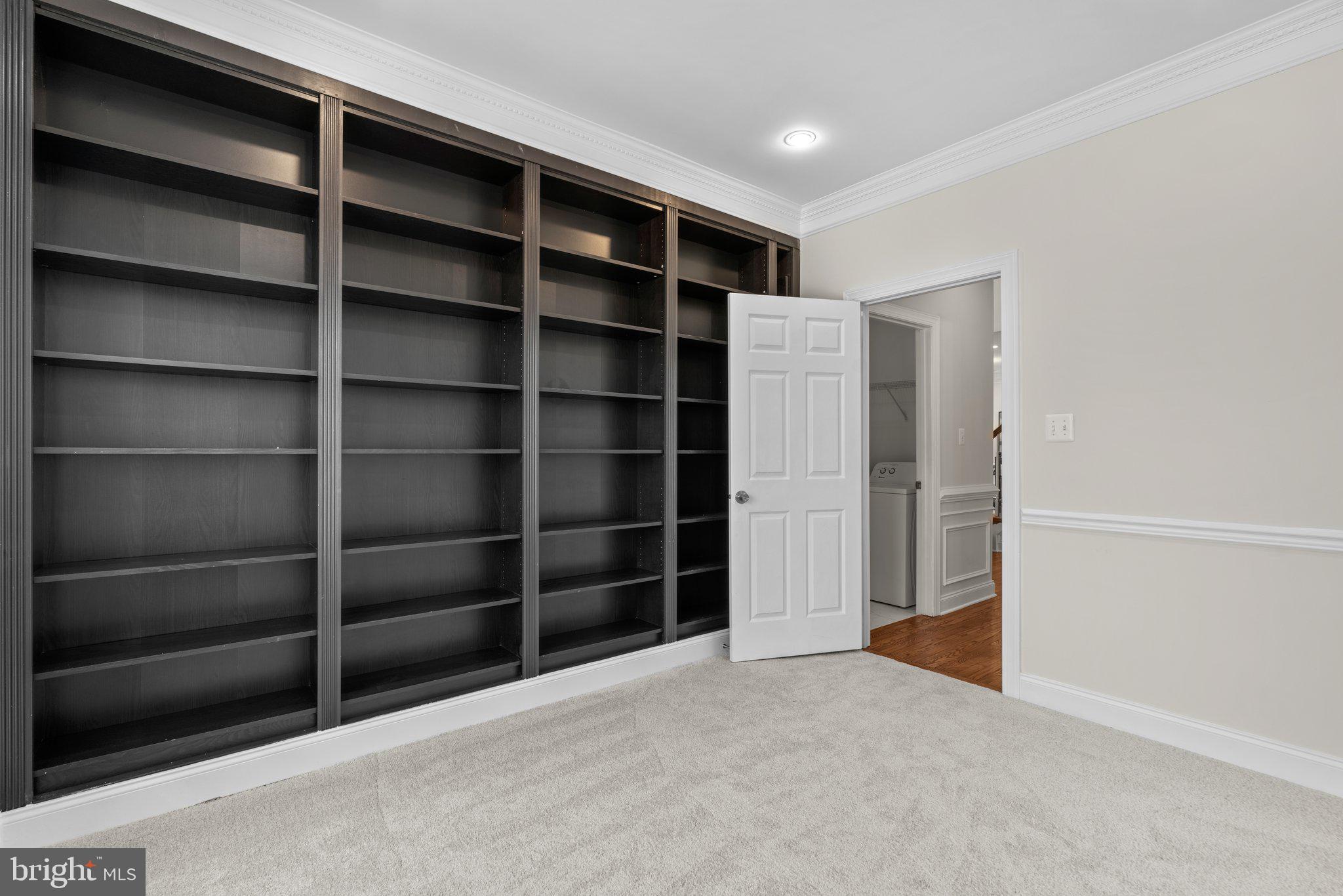 22104 Ginger Tree Way Clarksburg, MD 20871 - Photo 25 of 57 a view of an empty room with empty shelves